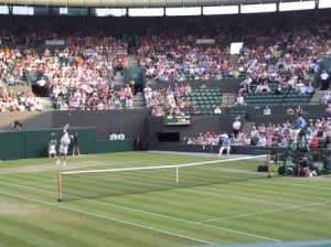 Taken from my seat on Court 1 - Andy Roddick serving. Note the empty corporate seats on the right which SHOULD be taken up by real fans.