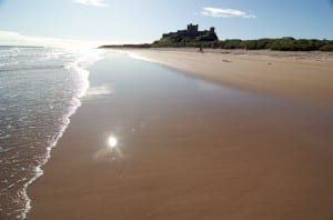 Bamaburgh_castle_water_sand